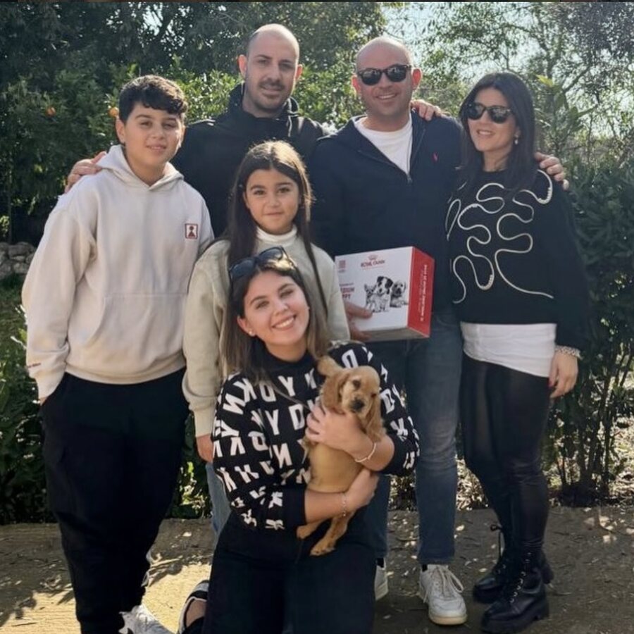 A family with their new puppy