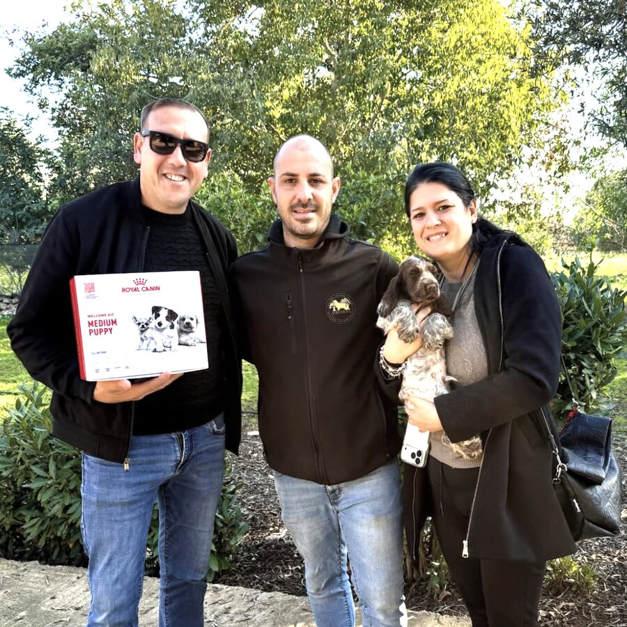 A family with their new puppy