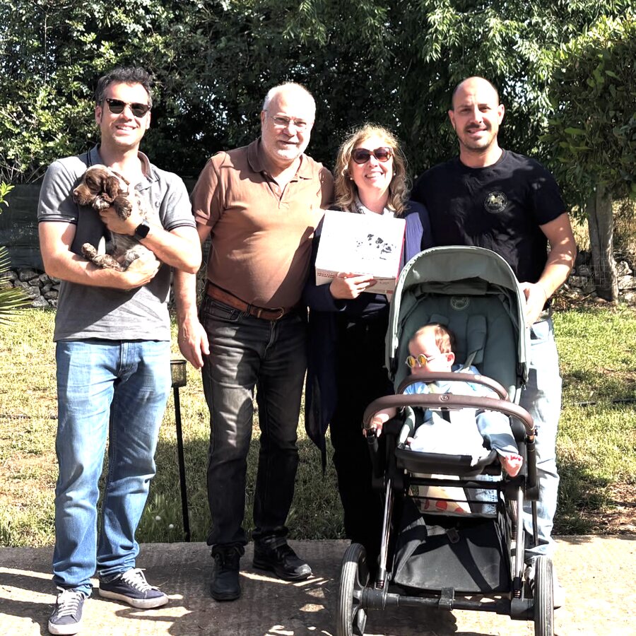 A family collecting their Cocker Spaniel puppy