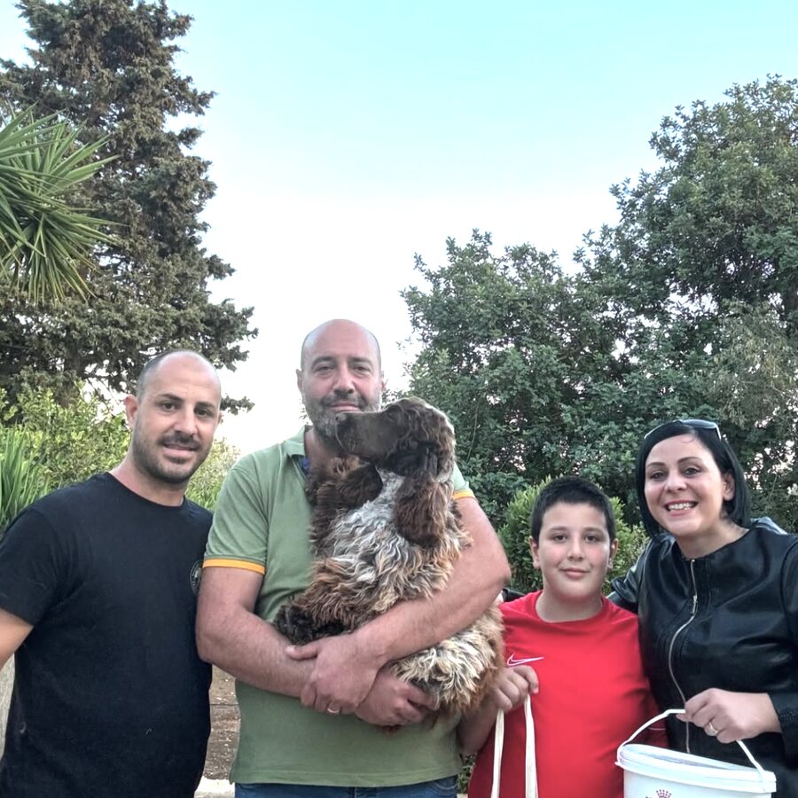 A family collecting their Cocker Spaniel puppy