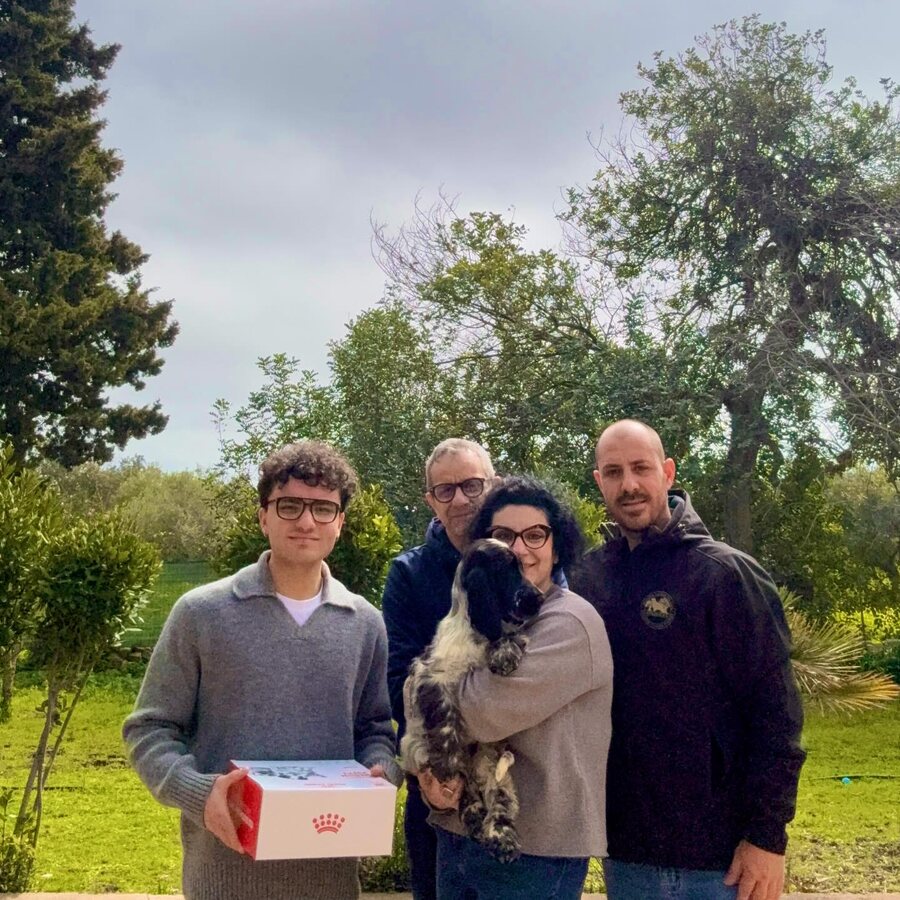 A family collecting their Cocker Spaniel puppy
